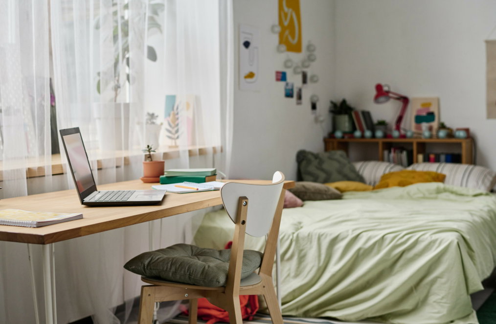 A student dorm room with limited storage space