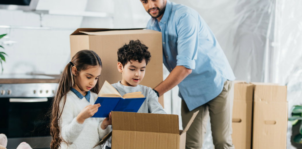 A couple packing boxes ahead of a move