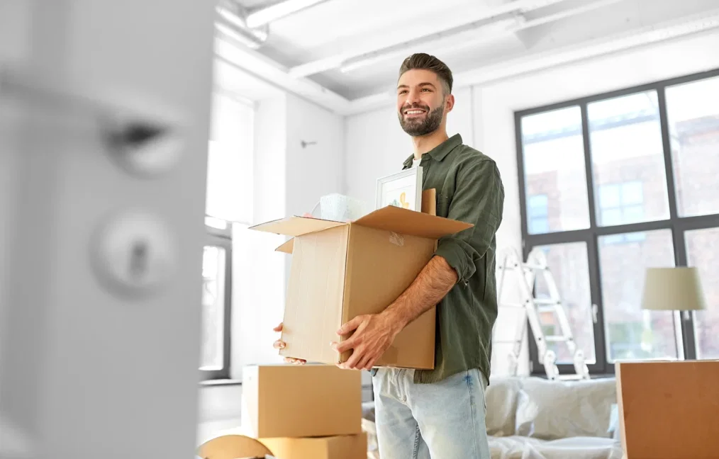 A couple packing boxes during a move