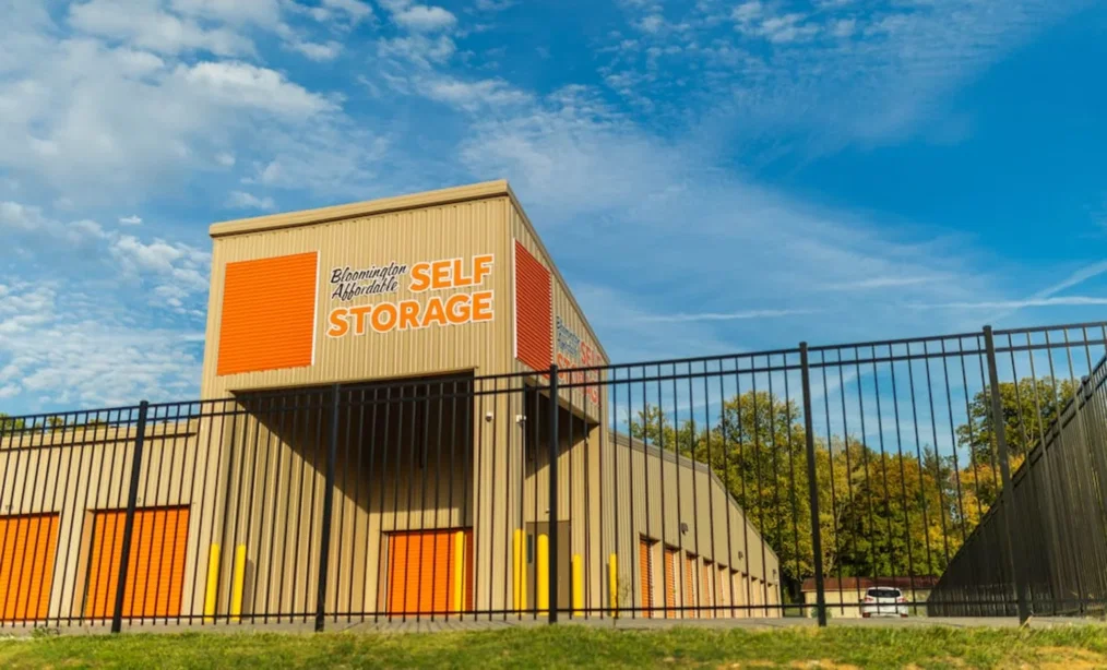A gated entrance with keypad access at a storage facility