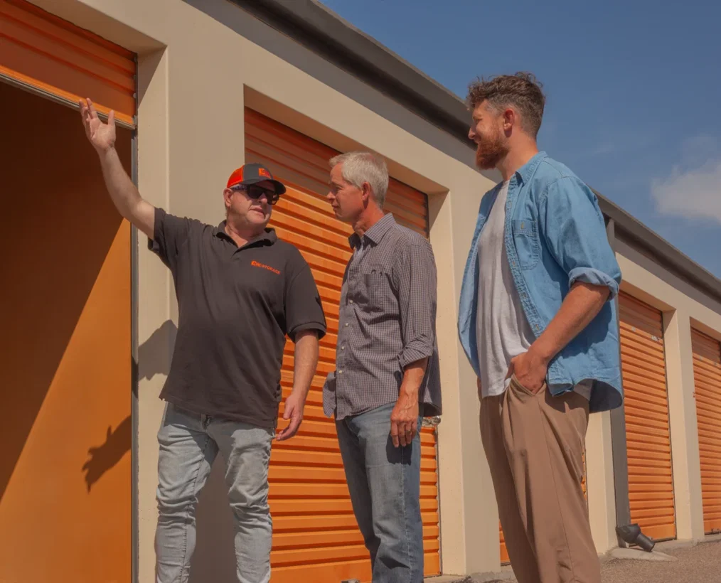 A long row of drive-up storage units with vehicle access