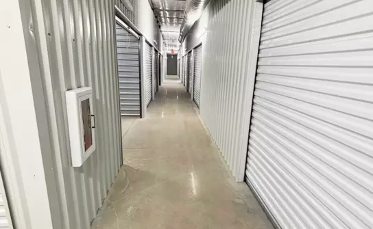 climate-controlled-storage.webp Inside hallway of storage facility