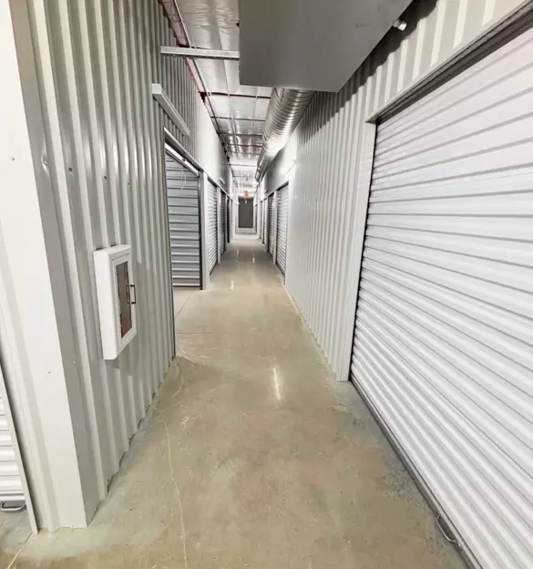 climate-controlled-storage.webp Inside hallway of storage facility