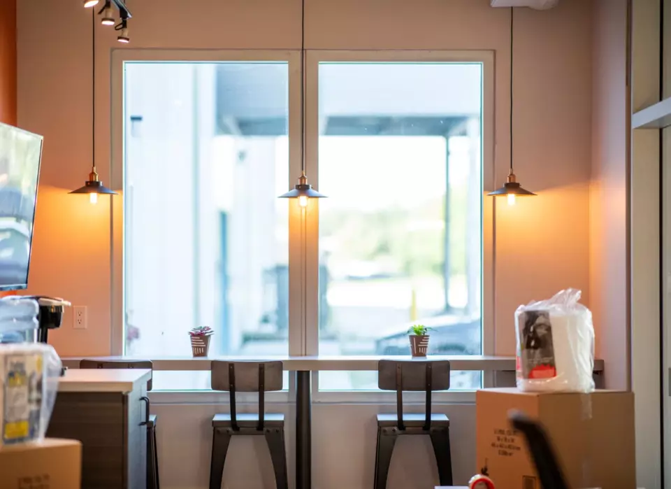 Interior-Bluebird-Stools-Looking-at-Window.webp Bluebird Interior with two stools and window view