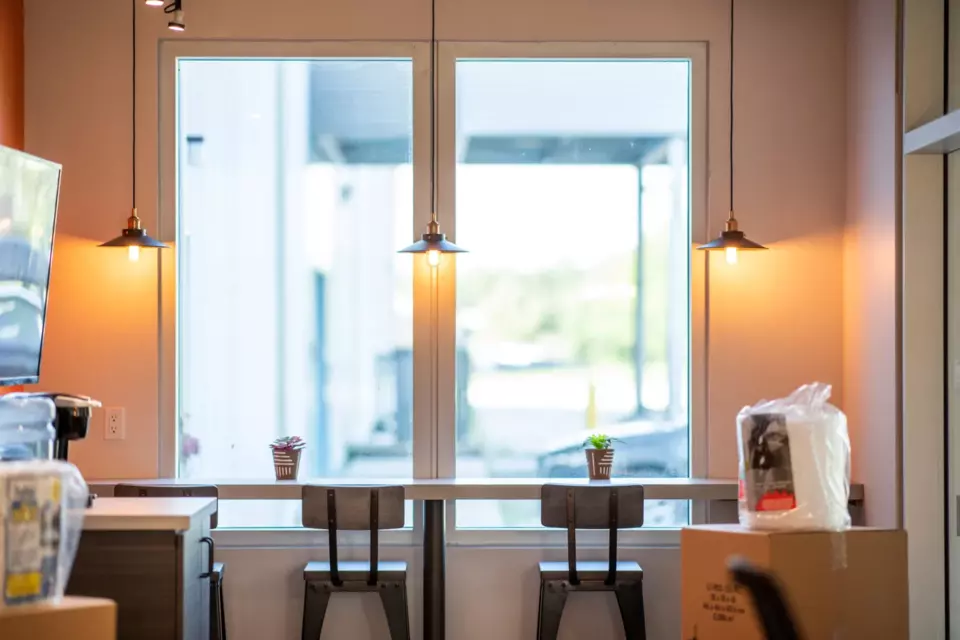 Bluebird Interior with two stools and window view