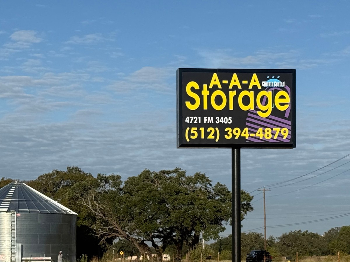 AAA Storage sign on FM 3405 in Georgetown, TX, showing the address and phone number