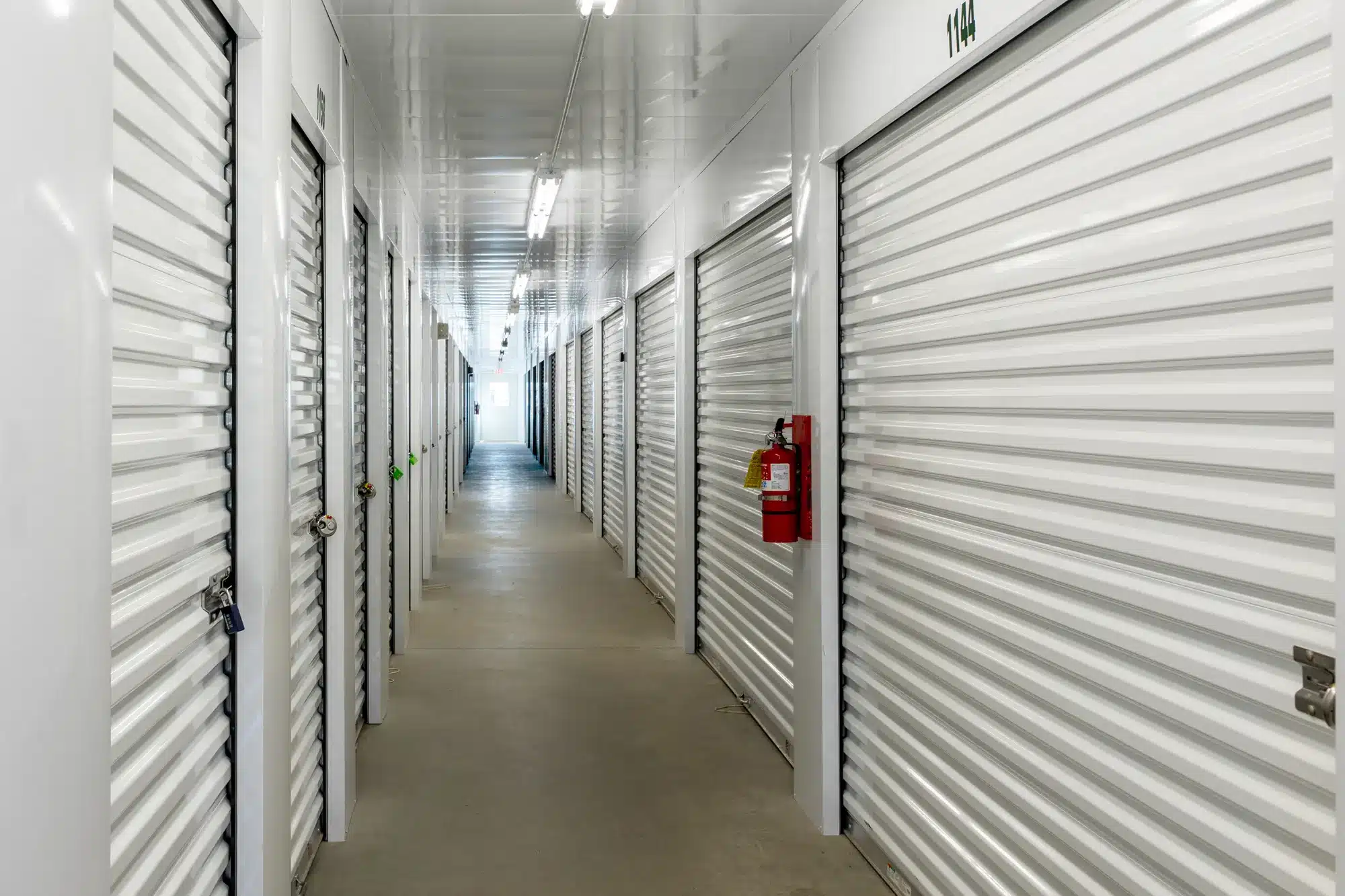 a long hallway of climate control storage units in various sizes