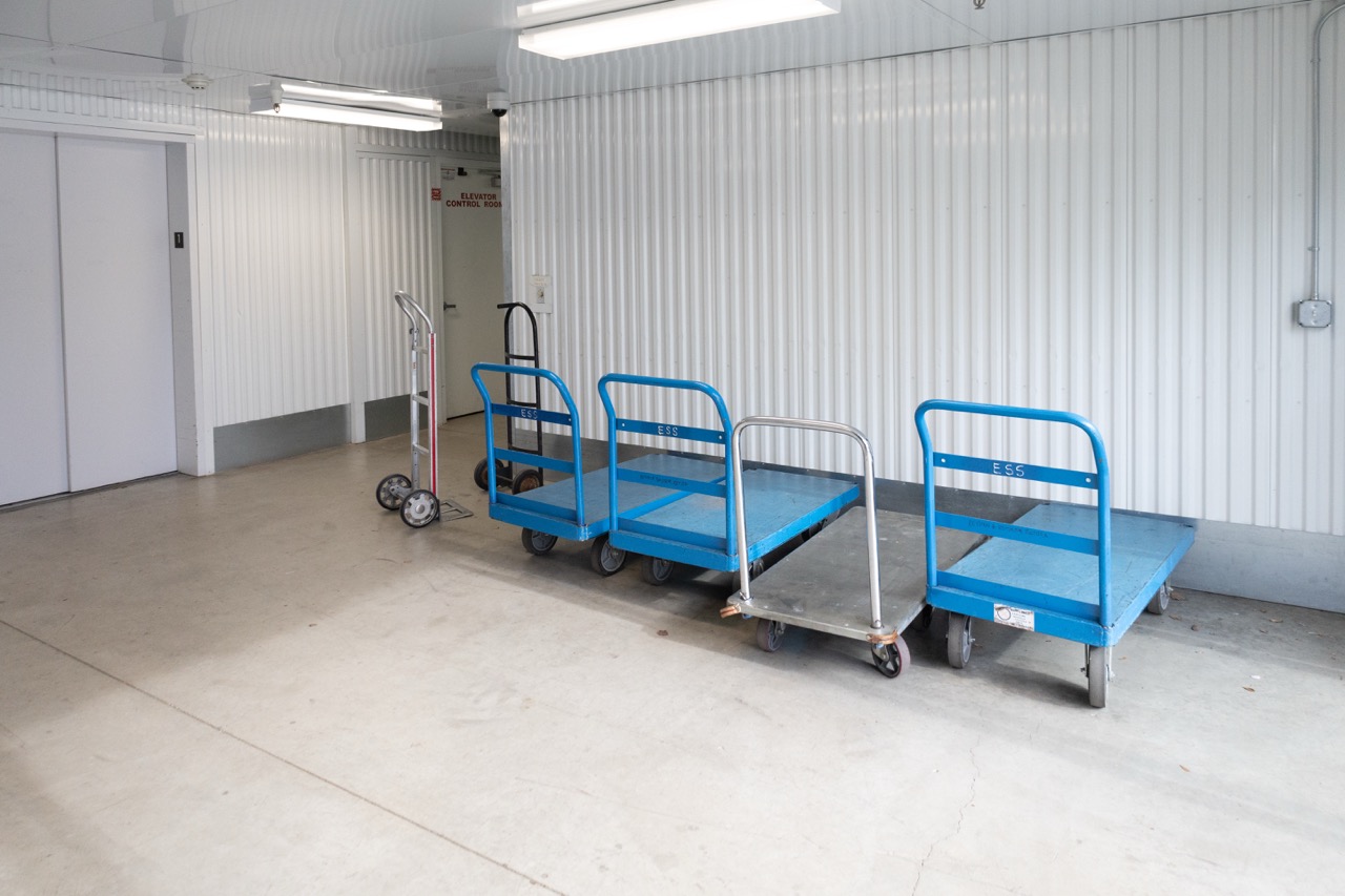 Indoor storage amenities including carts, elevators, and wide hallways