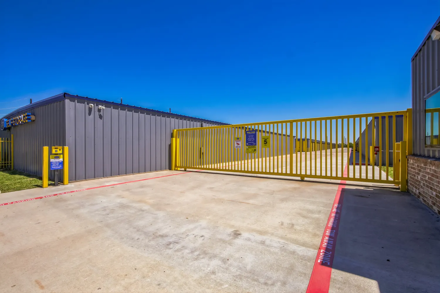 Secure gated access with keypad entry at Storage Star Baytown self storage facility